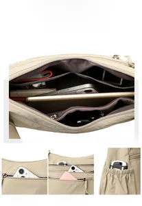 Detail view of khaki crossbody bag showing multiple pockets and large storage capacity