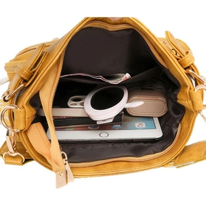 Top view of yellow soft PU leather bag interior showing large capacity and brown lining