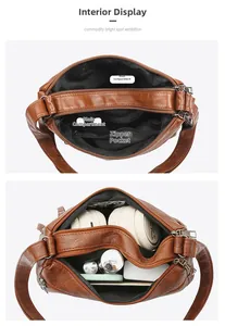 Detail view of the brown leather shoulder bag interior with multi-compartment storage