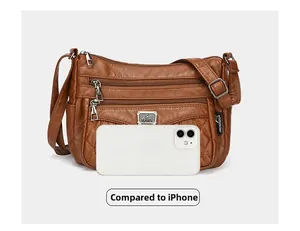 Brown quilted PU leather crossbody bag size comparison with a smartphone reference