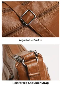 Detail of adjustable strap buckle and reinforced stitching on brown leather shoulder bag