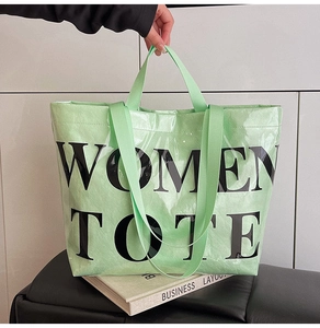 Detail of mint green waterproof tote bag featuring Women Tote print on woven fabric