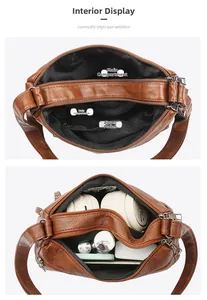Detail view of multi-compartment interior for brown soft leather shoulder bag