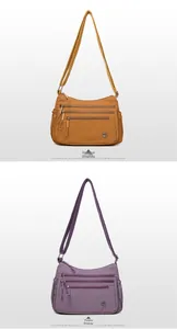 Vertical view of orange and purple nylon crossbody bags with multiple functional zippers