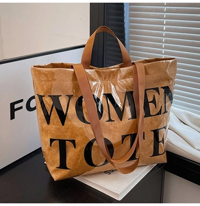 Macro detail of waterproof PVC tote bag with brown paper interior and Women Tote print