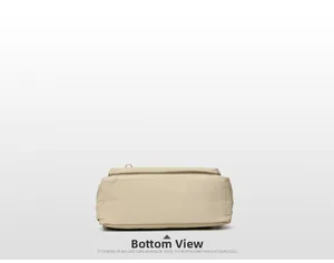 Detailed bottom view of minimalist beige canvas tote bag with reinforced stitching