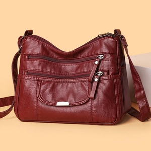 Deep red soft leather crossbody bag for women with multi-zipper layers and silver rivets