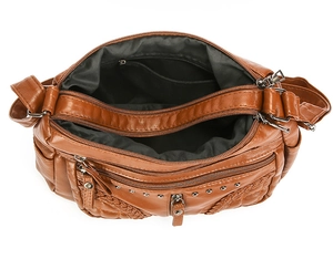 Top view of brown soft leather crossbody bag showing multiple zip compartments and lining