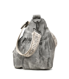 Detail of grey washed leather tote with geometric jacquard strap and side pocket