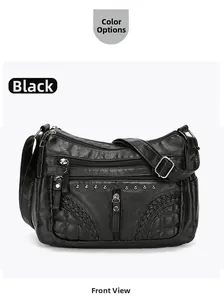 Detail of black multi-layered crossbody bag with pebble leather texture and silver rivets