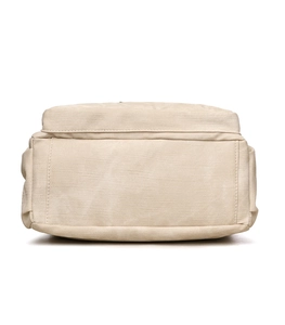 Detailed close-up of durable cream canvas tote bag bottom with reinforced stitching