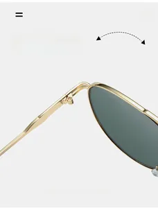 Close-up of durable metal hinges and dark green lenses on pilot sunglasses