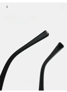Close-up of ergonomic curved black glasses legs with polished finish for comfortable wear