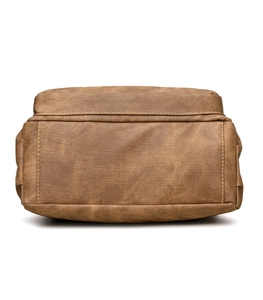 Close-up of brown faux leather tote bag with vintage texture and precise stitching