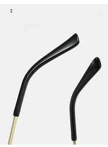 Detail of curved ergonomic temple tips on black and gold pilot sunglasses