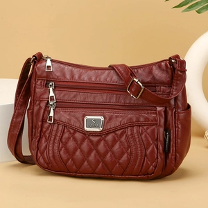 Deep wine red quilted leather crossbody bag with adjustable strap and multi-zipper pockets