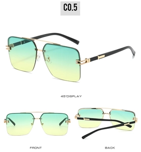 Detail view of gold metal half-frame sunglasses with green-yellow gradient lenses