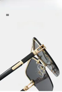 Detail of golden hinges and lightweight flexible temples on retro square sunglasses