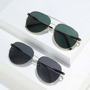 Classic aviator sunglasses with metal frames and double bridge design on white platform