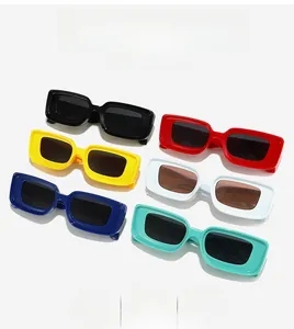 Flat lay of retro square sunglasses in black, red, yellow, and blue plastic frames