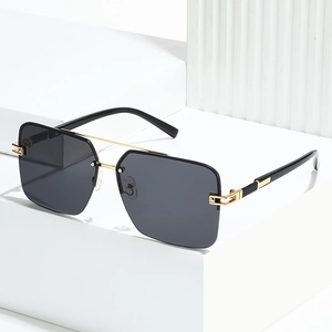 Modern semi-rimless square sunglasses with dark grey lenses and gold metal frames