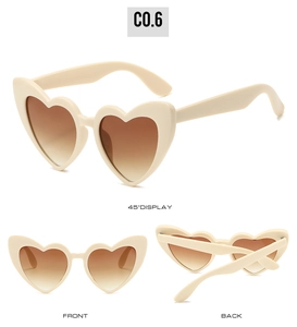 Three-angle view of cream heart-shaped sunglasses with gradient brown lenses on white backdrop
