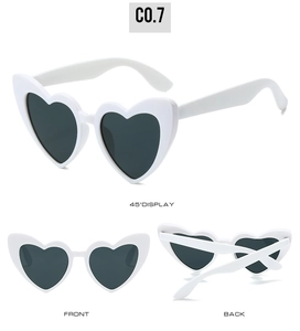 Three-way view of white heart-shaped sunglasses with dark lenses and glossy finish
