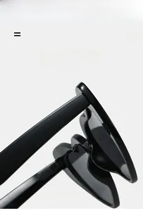 Close-up of heart-shaped sunglasses showing wavy frame details and flexible hinge