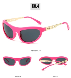 Cat eye pink sunglasses with hollow gold metal temples and dark grey lenses detail