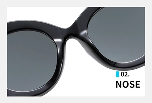 Detail of the integrated nose pads on black fashion sunglasses with glossy finish
