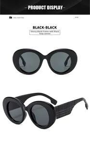 Fashionable oversized sunglasses with wide checkered pattern temples and dark grey lenses