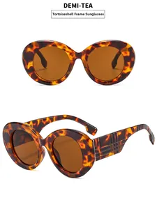 Detail of tortoise sunglasses featuring a textured check pattern on the temple arms