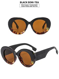 Detail of vintage oval sunglasses with black and tortoise frame and tea lenses