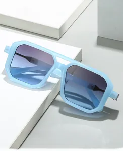 Detail of square pilot sunglasses with light blue frame and gradient lenses