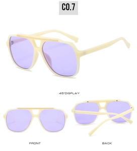 Detail view of double-bridge aviator sunglasses with cream frames and purple lenses