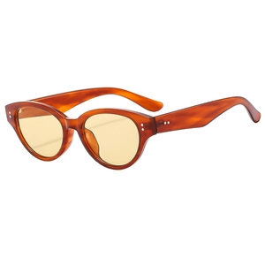 Vintage cat eye sunglasses with amber frames and yellow lenses in a stylish retro design