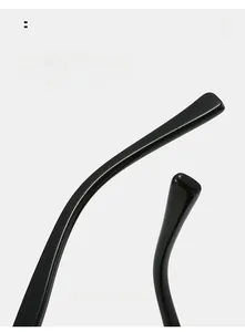 Detail view of glossy black curved temples designed for comfortable ergonomic eyewear fit