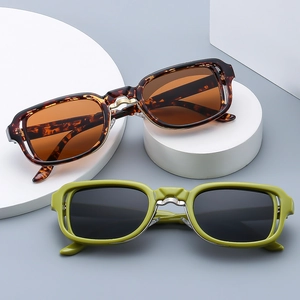 Fashionable square sunglasses in tortoiseshell and green colors with narrow frames