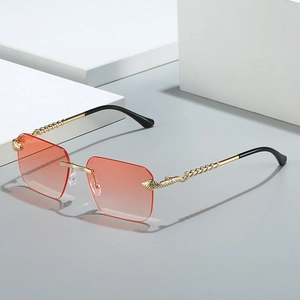 Lunettes de soleil carrées sans monture avec verres dégradés orange et branches serpent dorées