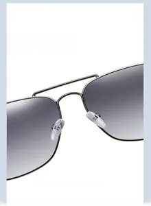 Macro shot of adjustable silicone nose pads on square stainless steel aviator sunglasses