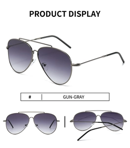 Detail view of gun-gray stainless steel pilot sunglasses with purple gradient lenses
