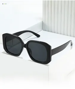 Detail of modern black oversized square sunglasses with thick temples on geometric props