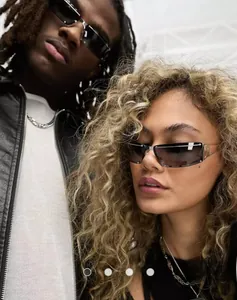 Detail view of rimless square sunglasses with industrial metal temples on a model