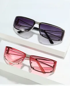 Detail of rimless square sunglasses featuring gradient lenses and metal stud accents