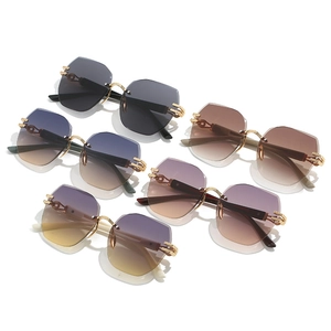 Frameless geometric sunglasses in multiple gradient colors with gold hollow chain temples