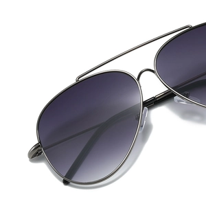 Classic aviator sunglasses with silver stainless steel frame and grey gradient lenses