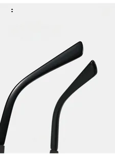 Detail of sleek black curved temples on rimless sunglasses for a comfortable secure fit