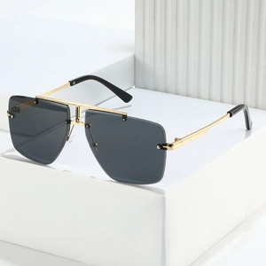 Lunettes de soleil carrées sans monture avec double pont doré et verres foncés