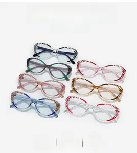 Flat lay of multiple color-block cat-eye glasses frames with geometric print on the temples