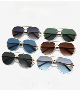 Close-up of pilot sunglasses with metal double bridge and C-shaped hinge detail